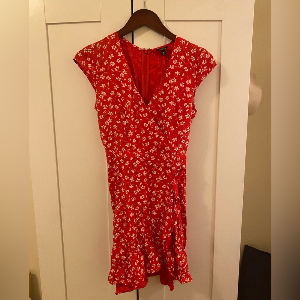 Red wrap dress with white floral details
